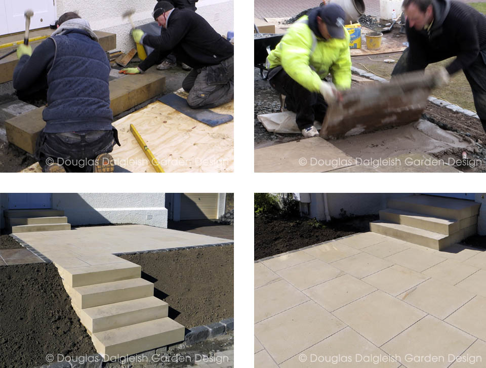 stonemasons building sandstone steps and laying garden paving