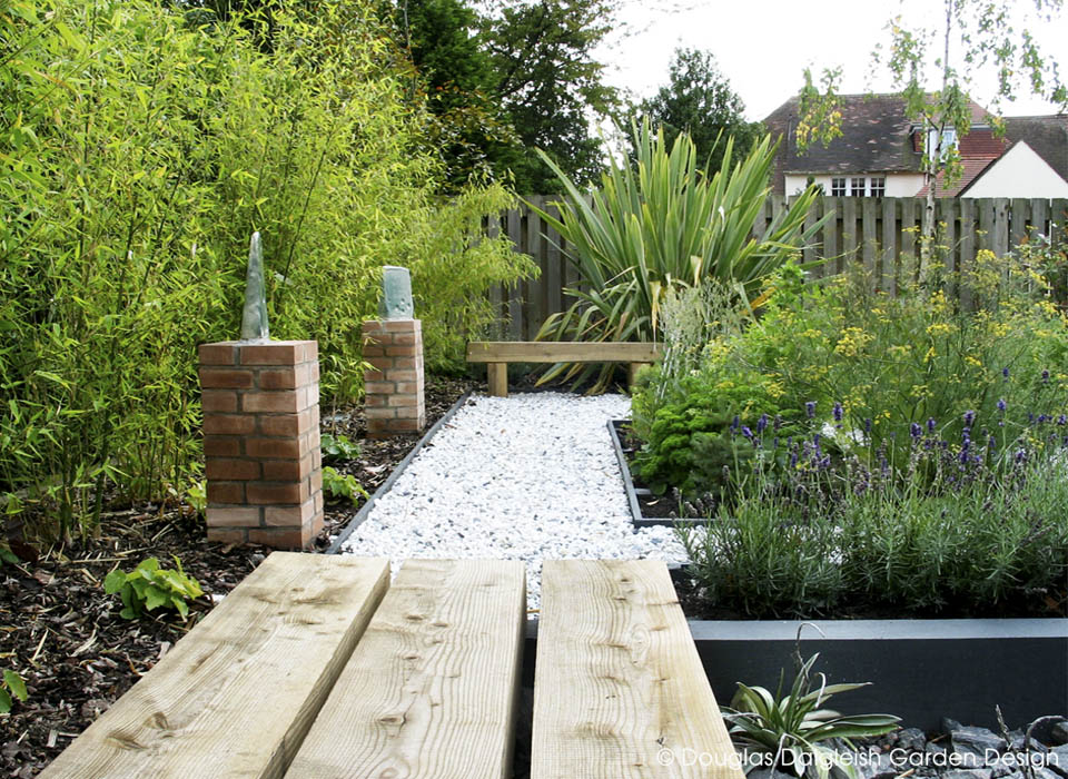 view from interior through wide open doors to the garden patio