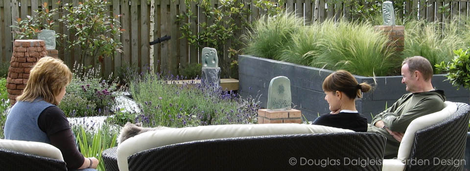 view from interior through wide open doors to the garden patio
