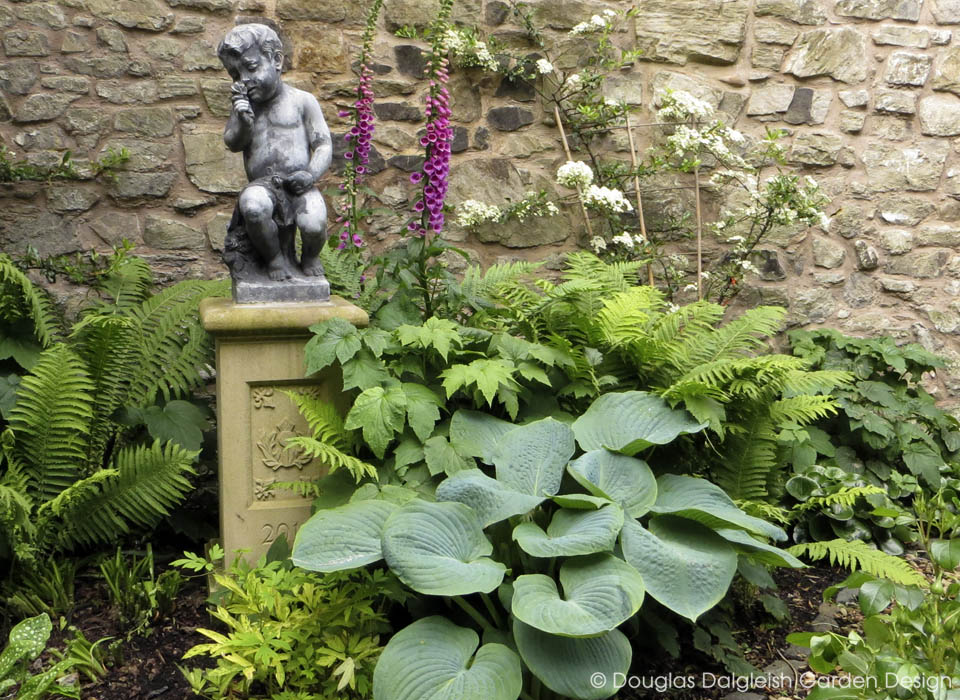 view across circular formal garden pond