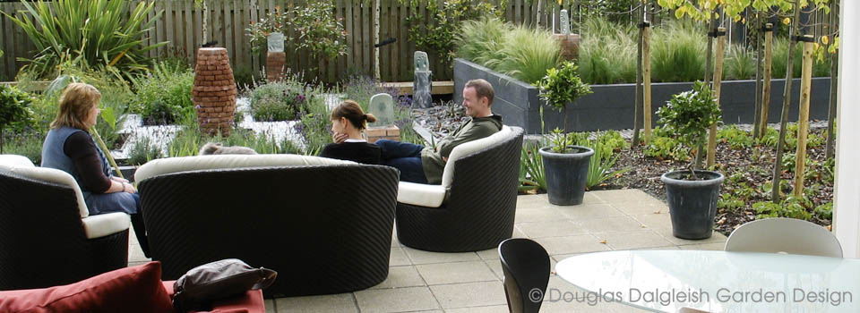view from interior through wide open doors to the garden patio